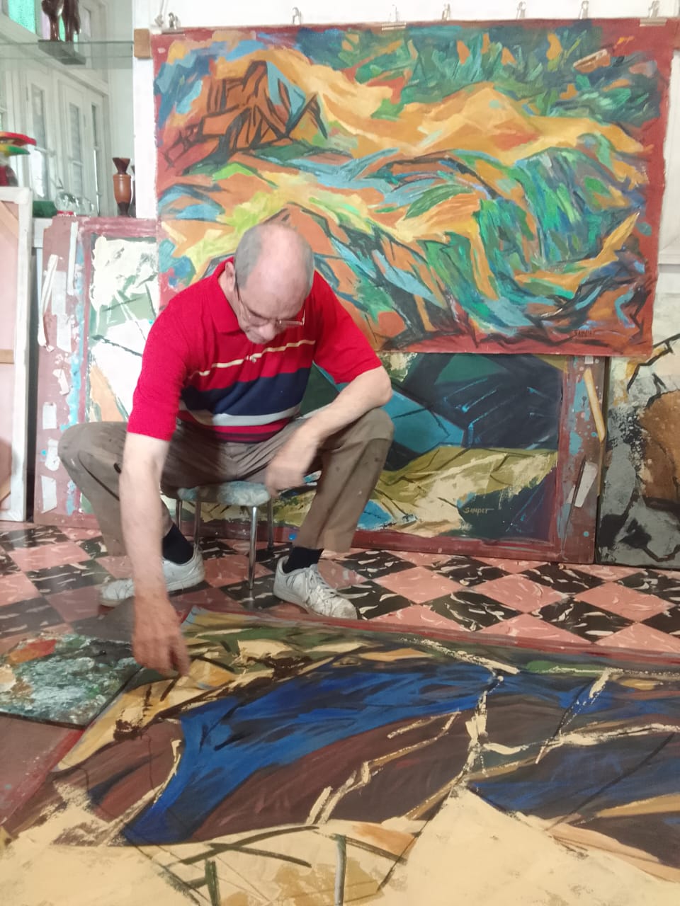 Artist working in a sun-drenched studio